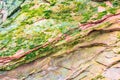 Colourful sedimentary rocks formed by the accumulation of sediments Ã¢â¬â natural rock layers backgrounds, patterns and textures - Royalty Free Stock Photo